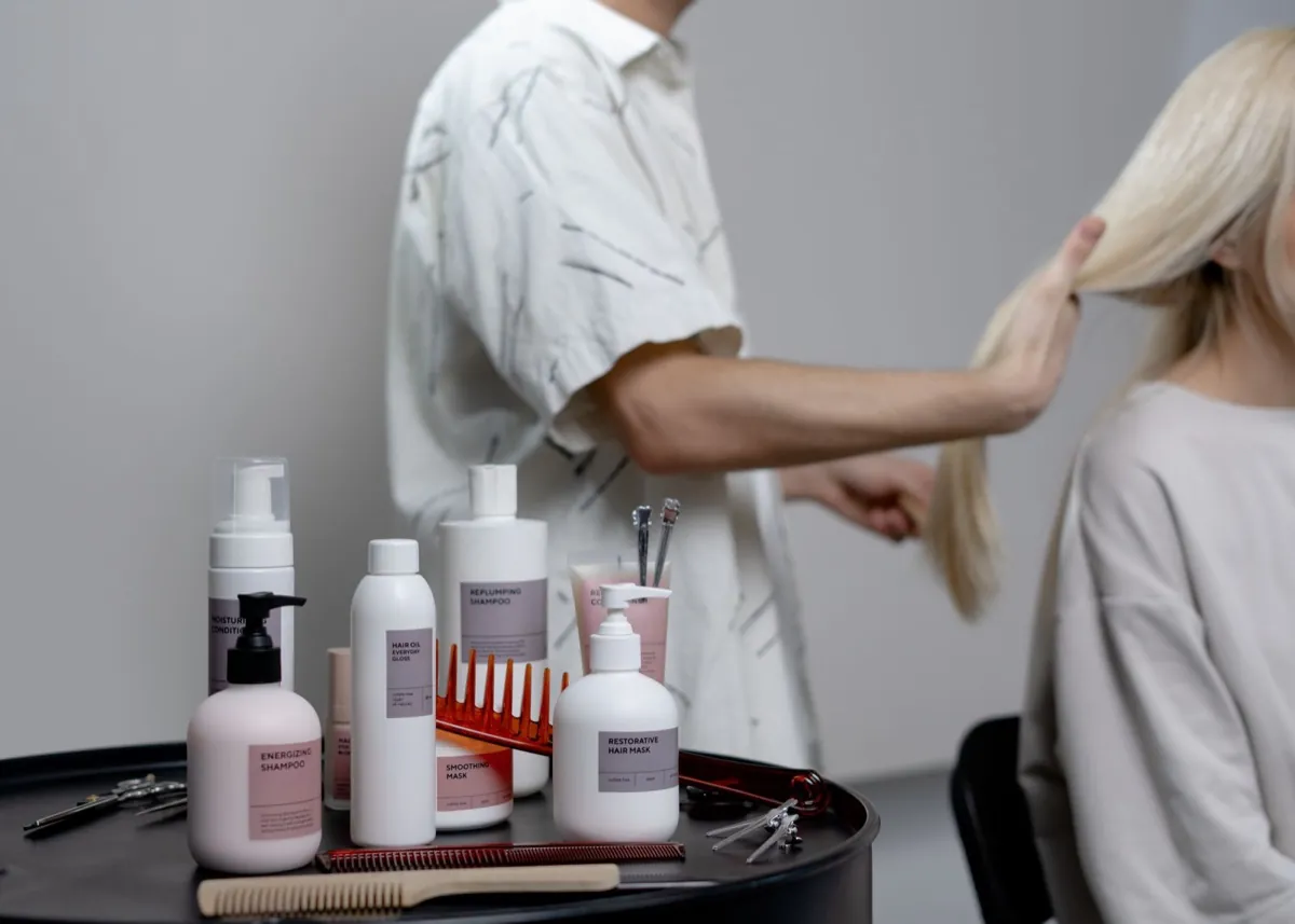 Hairdresser at work in a bright salon, a website for a salon step by step